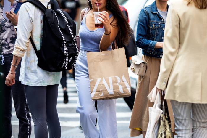 A shopper carries a Zara bag in New York
