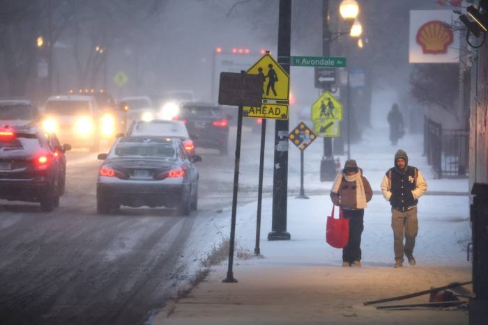 Pedestrians on a snow-covered street in Chicago